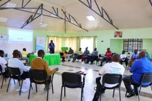 Staff listen on during a training session on AI for day-to-day operations
